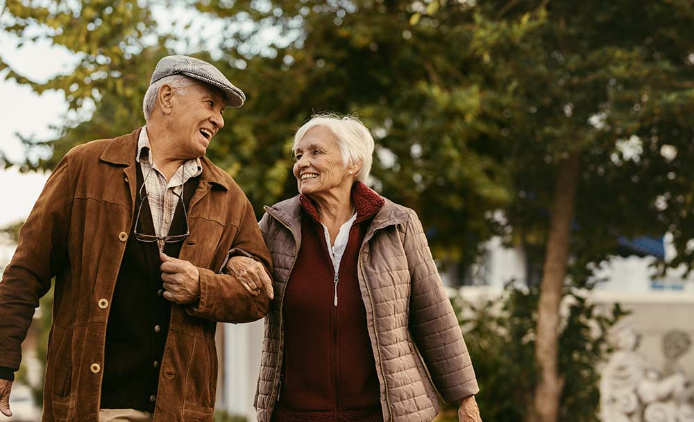 A happy senior couple discussing their inheritance to pass on to their family