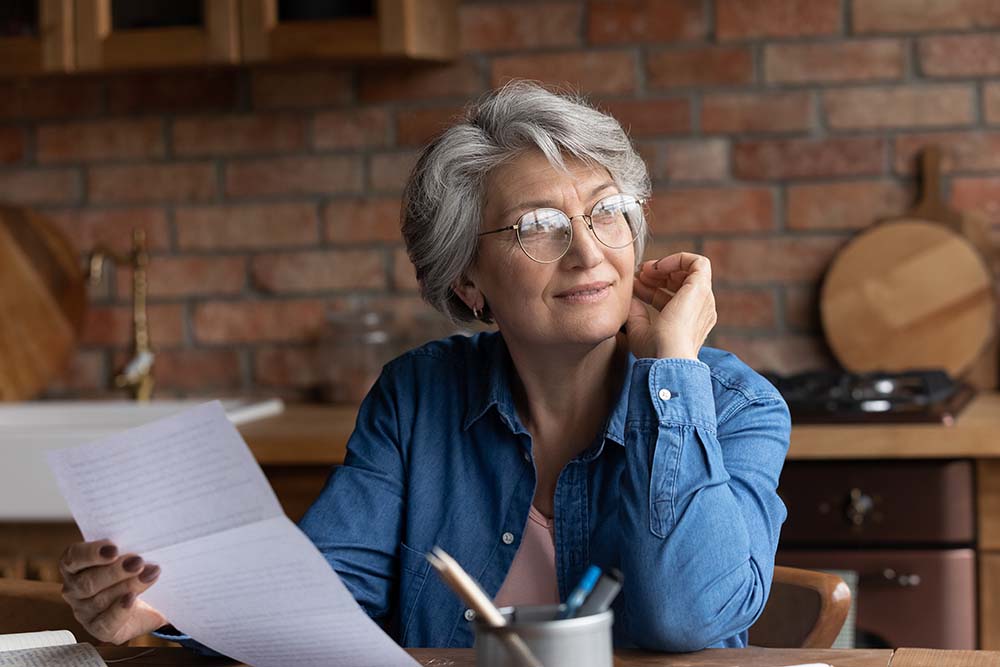 A senior woman understanding the differences between Wills and Trusts