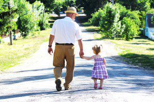 Happy grandfather and a minor granddaughter after avoiding common estate planning mistakes